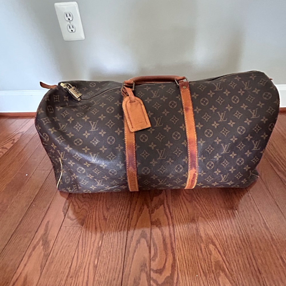 Authentic Vintage Louis Vuitton Keepall 60. With luggage tag and combo lock